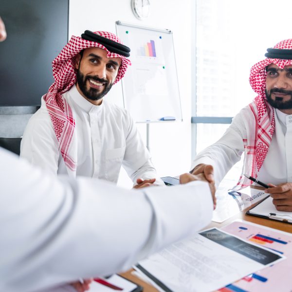 Arab businessmen wearing saudi kandura meeting in 2025 04 17 00 47 59 utc 1 600x600